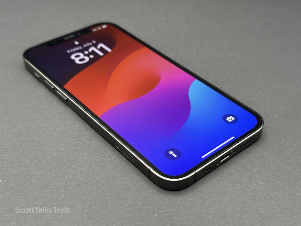 Space gray Apple iPhone 12 Pro lying face up with screen on