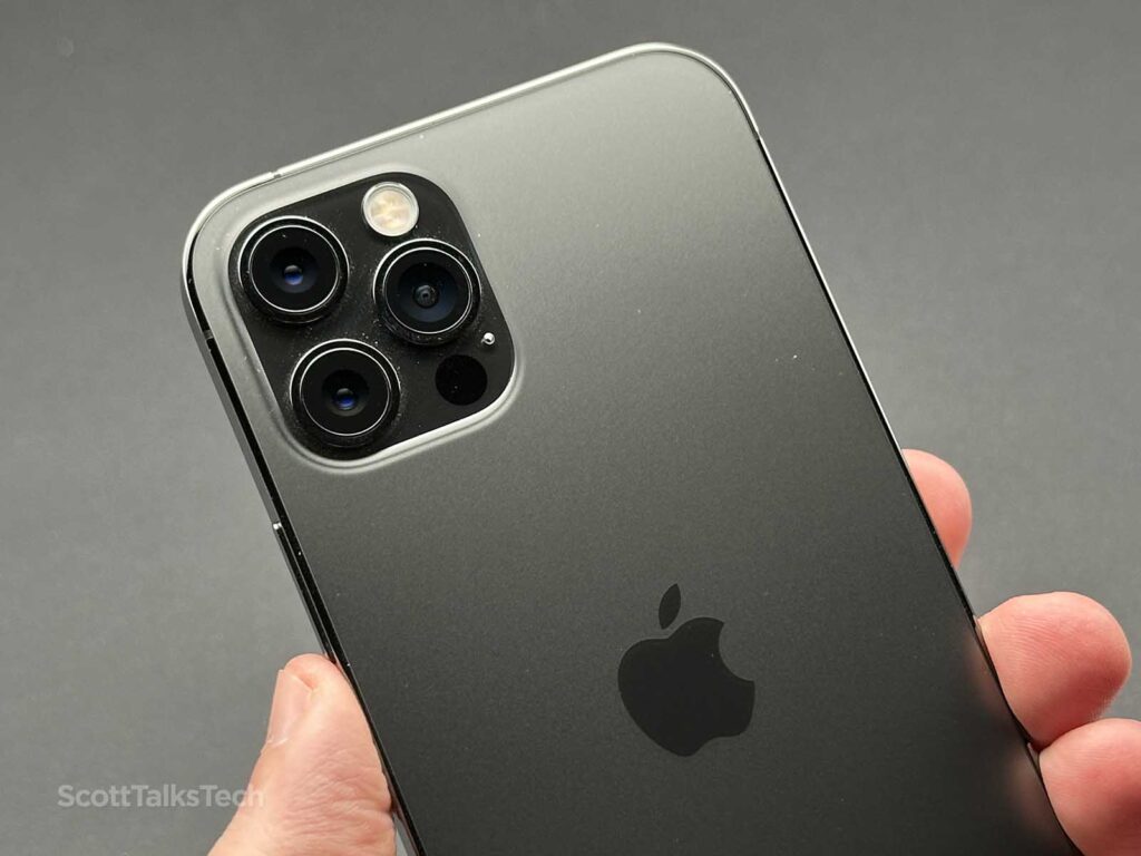 Holding my Space gray Apple iPhone 12 Pro showing the cameras