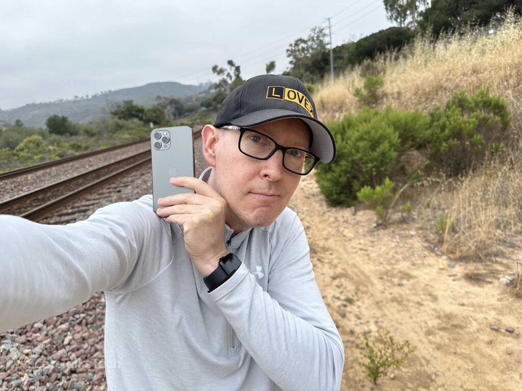 Scott holding and admiring his space Gray iPhone 12 Pro