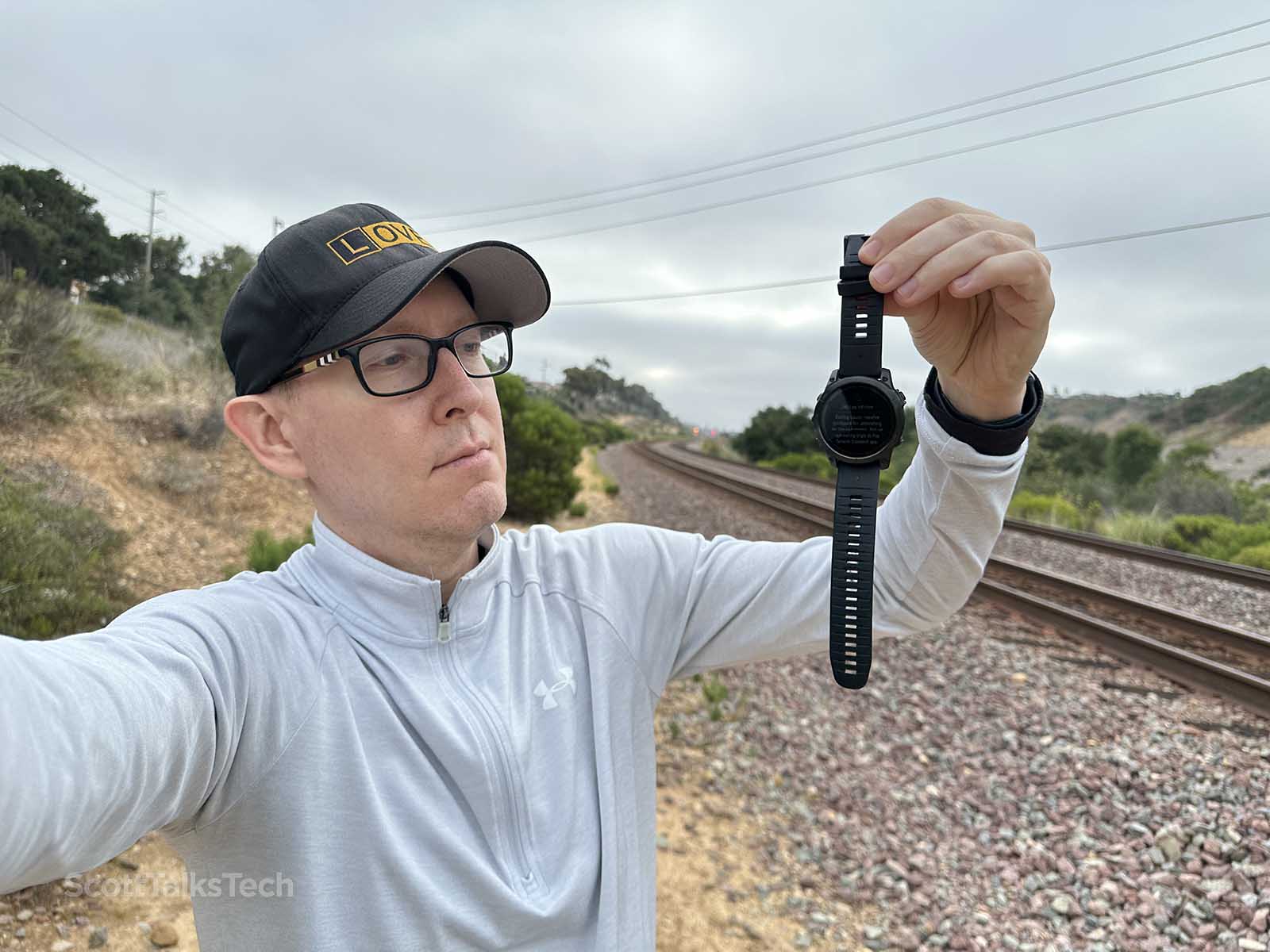 Scott holding his Epix Pro (Gen 2) smart watch