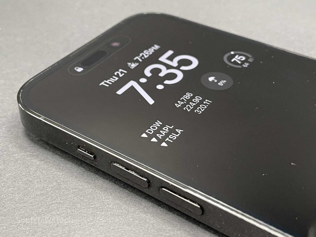 Space Black iPhone 14 Pro always on display with widgets close up