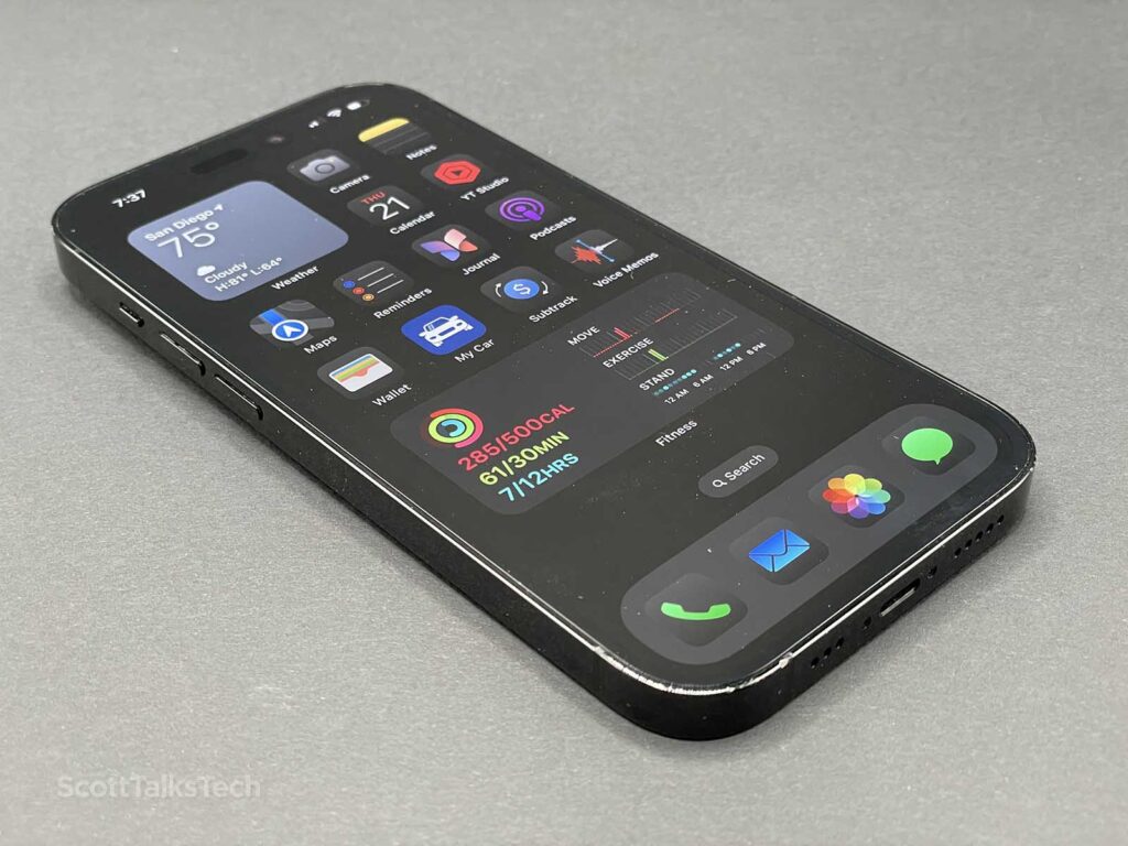 Space Black iPhone 14 Pro lying face up with screen on