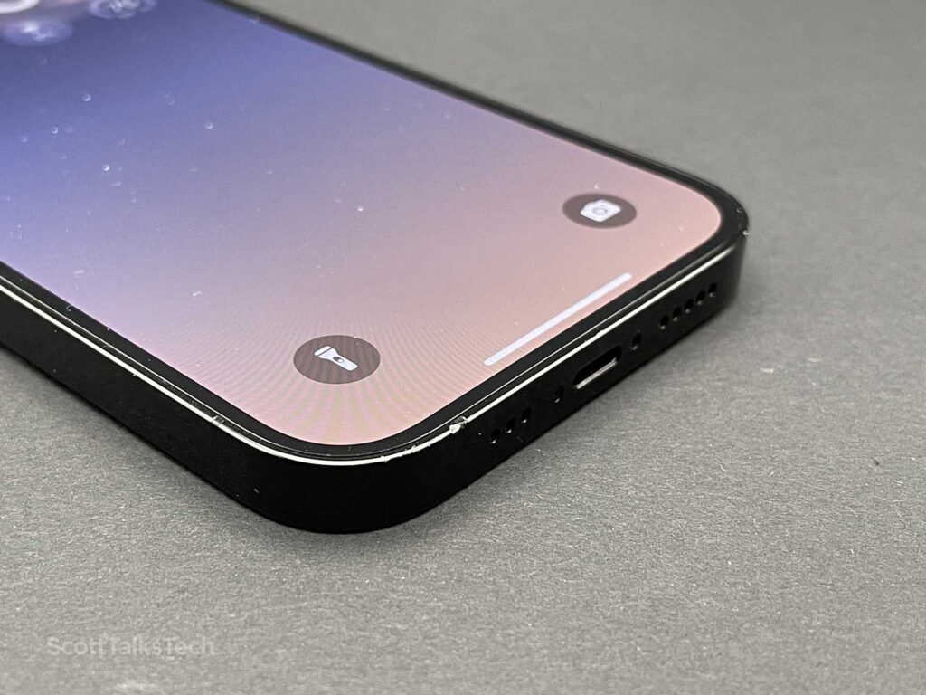 Space Black iPhone 14 Pro screen on showing shortcut buttons on the lock screen